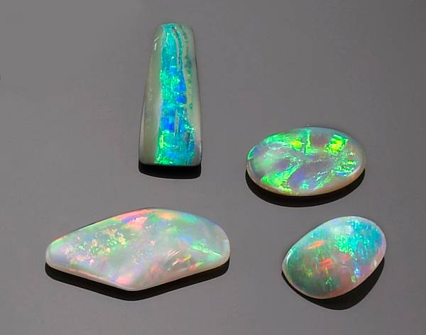 Appraisal: Sampler of Four Australian Opals Including a freeform cabochon gray