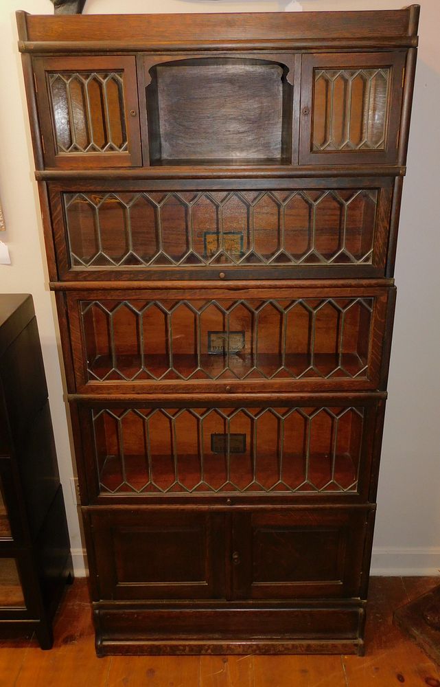 Appraisal: ANTIQUE OAK LEADED GLASS STACK BOOKCASE Wonderful five section quarter-sawn