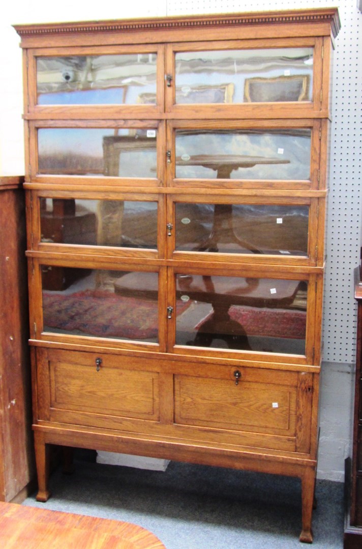 Appraisal: A th century oak five section bookcase by 'Chapter' cm