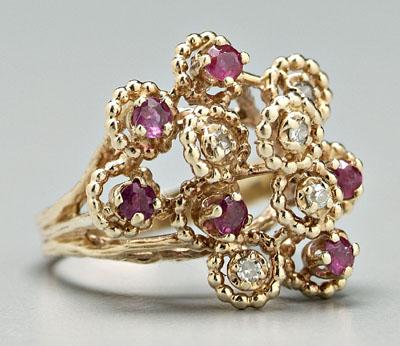 Appraisal: Lady's ruby and diamond ring six round faceted rubies estimated