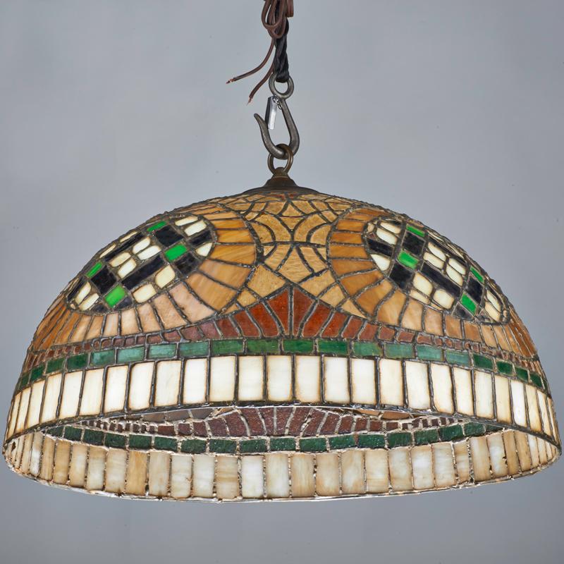 Appraisal: ARTS AND CRAFTS Hemispheric leaded glass hanging shade USA Slag