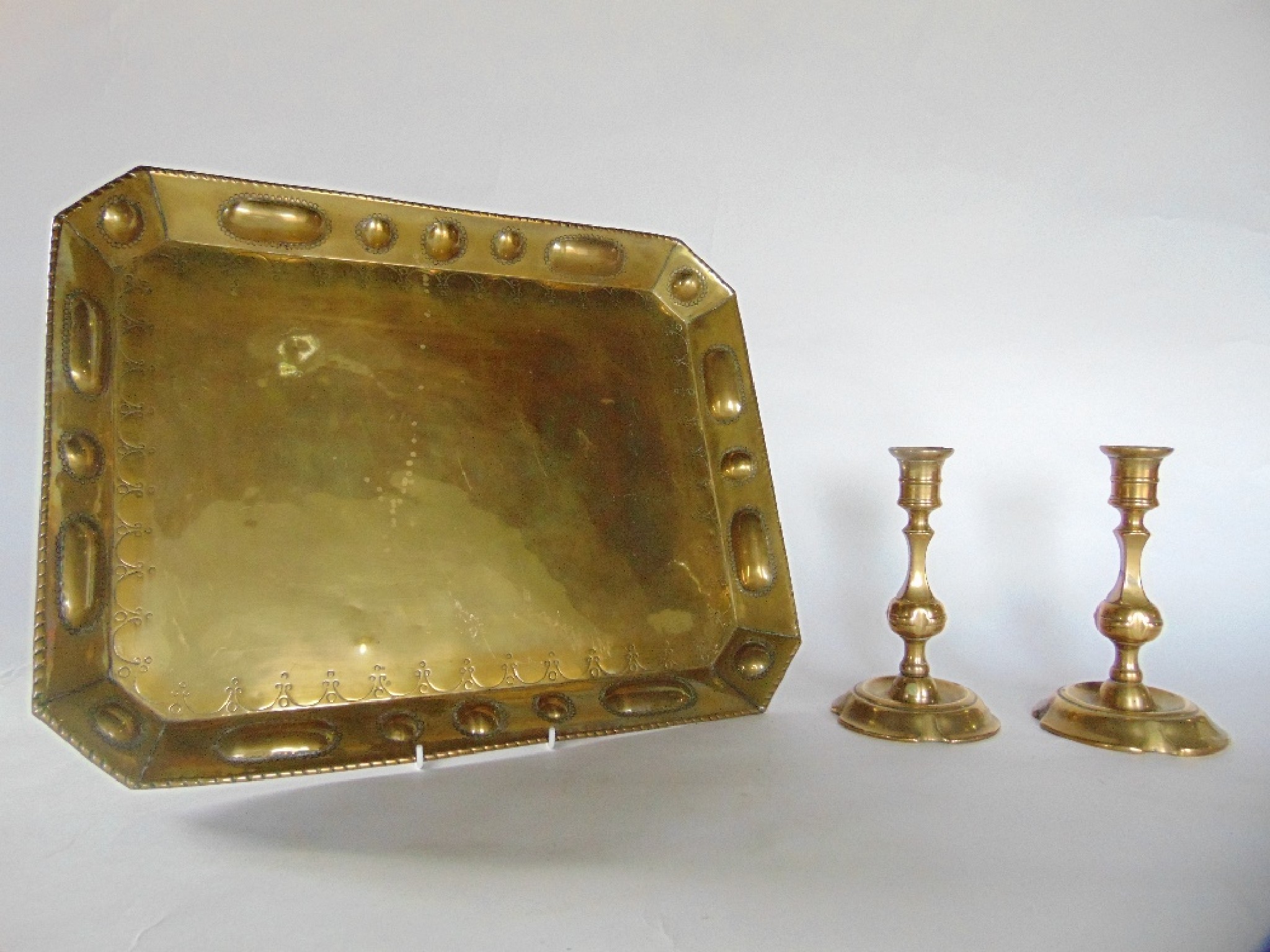 Appraisal: An antique brass tray of rectangular form with canted corners