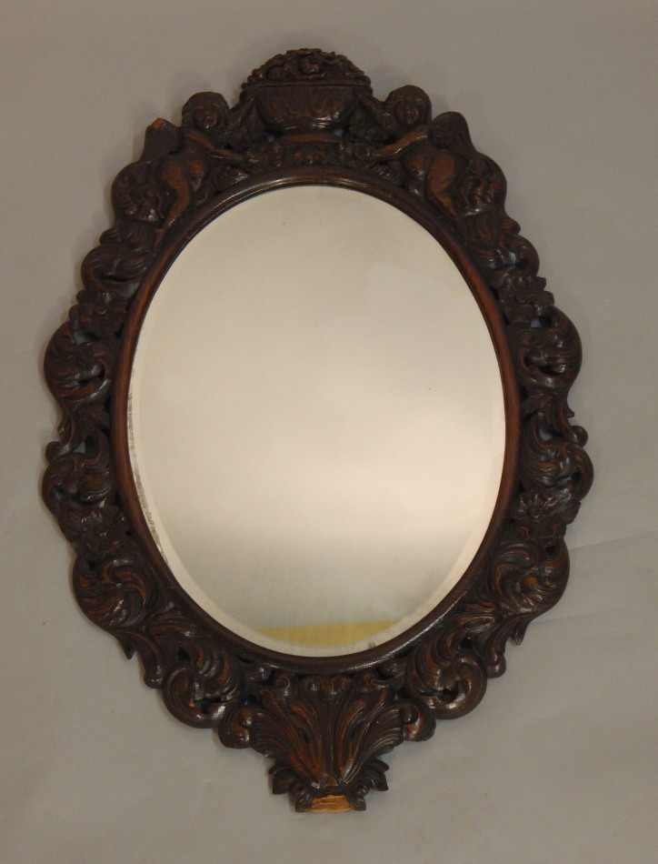 Appraisal: A thC carved oak wall mirror in Charles II style