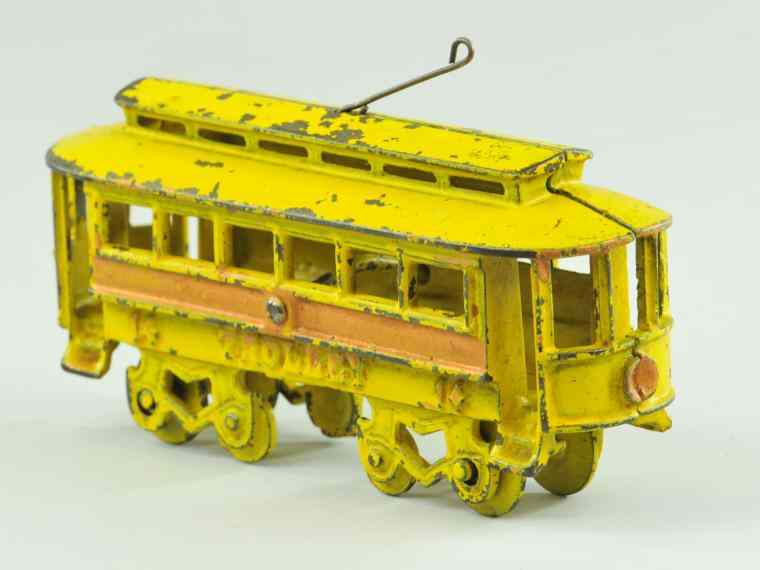 Appraisal: KENTON TROLLEY Kenton scarce example cast iron painted in yellow