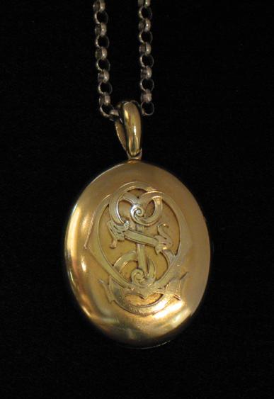 Appraisal: AN CT YELLOW GOLD OVAL LOCKET PENDANT with relief initials