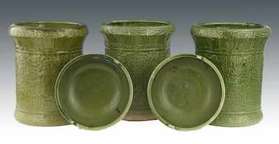 Appraisal: Three Green Glazed Ceramic Garden Urns The urns each measure