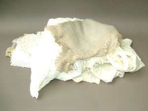 Appraisal: A collection of children's clothes undergarments and napery most with