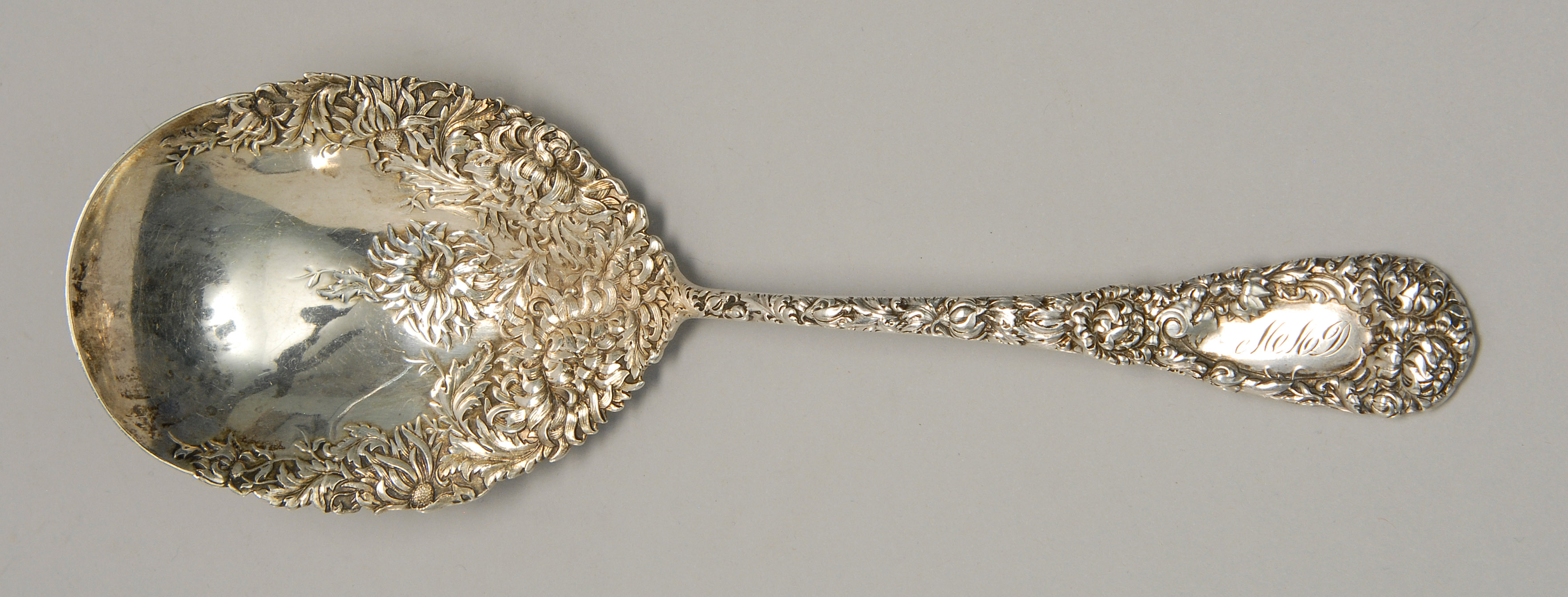 Appraisal: DURGIN STERLING SILVER BERRY SPOON In the Chrysanthemum pattern Monogrammed