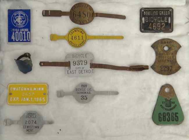 Appraisal: Lot license plates badges Owatonna Minn Dickinson ND Lewistown Mont