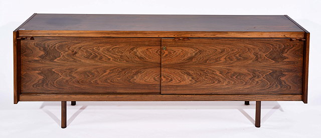 Appraisal: Danish rosewood sideboard circa ssliding doors opening to reveal shelves