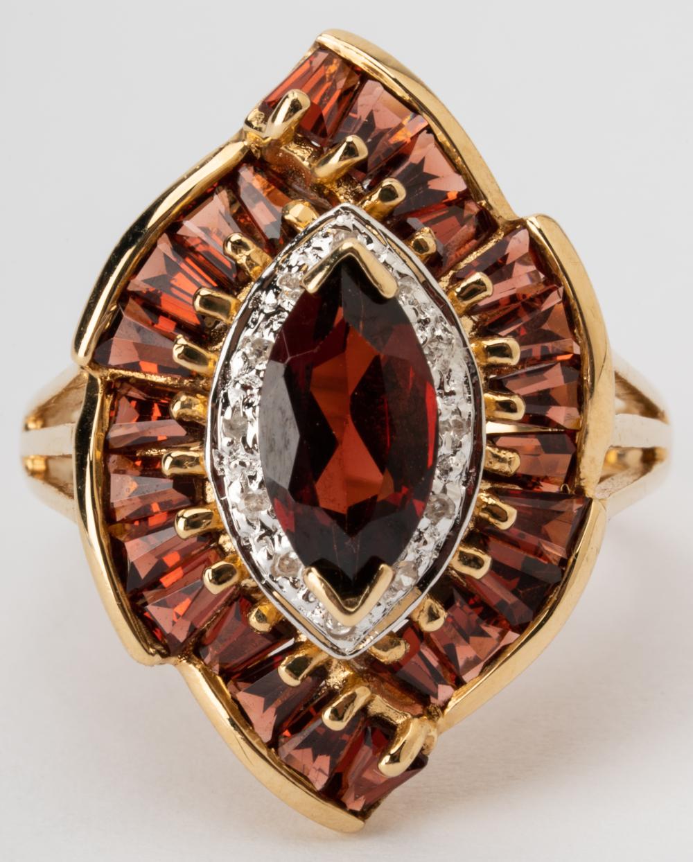 Appraisal: KARAT YELLOW GOLD GARNET DIAMOND RINGCentering one marquise garnet weighing