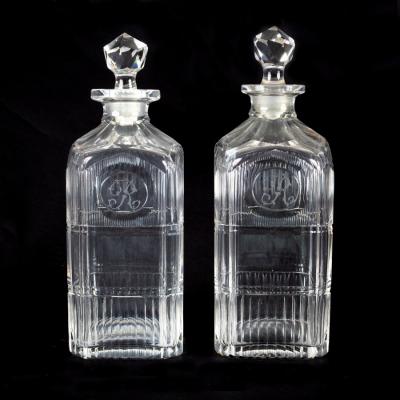 Appraisal: A pair of Georgian glass square cut decanters with canted