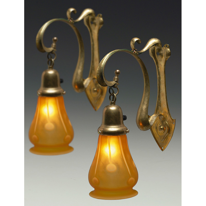 Appraisal: Art Nouveau sconces pair hammered brass holding an art glass