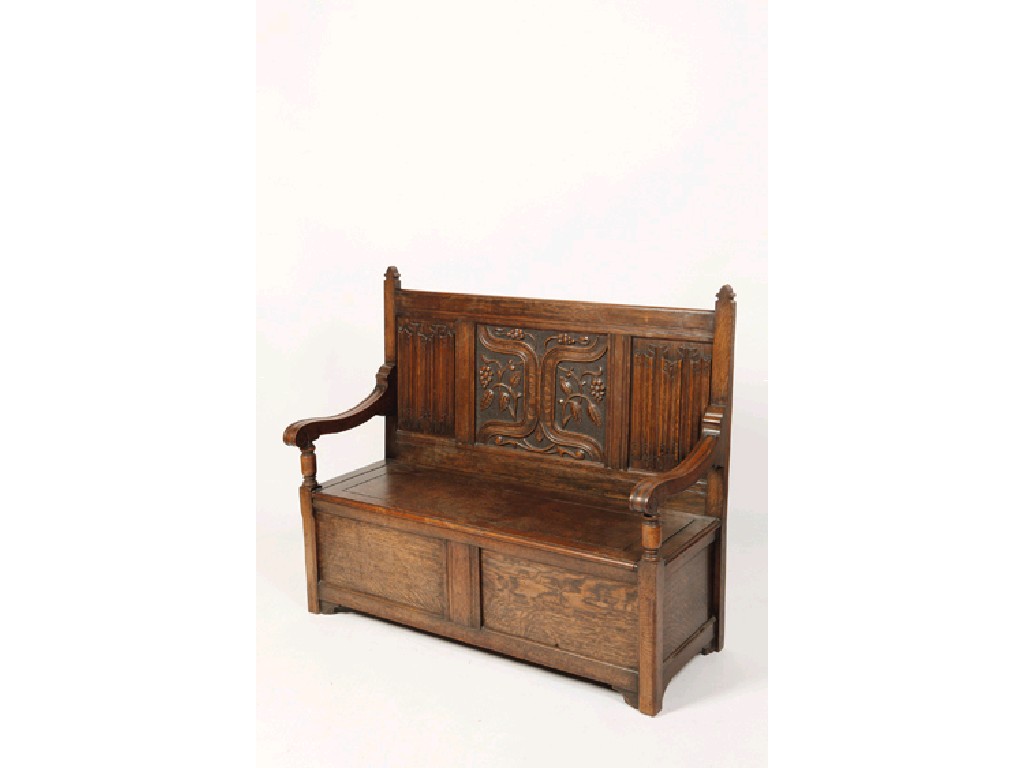 Appraisal: A CHARLES II STYLE CARVED OAK MONKS BENCH with a