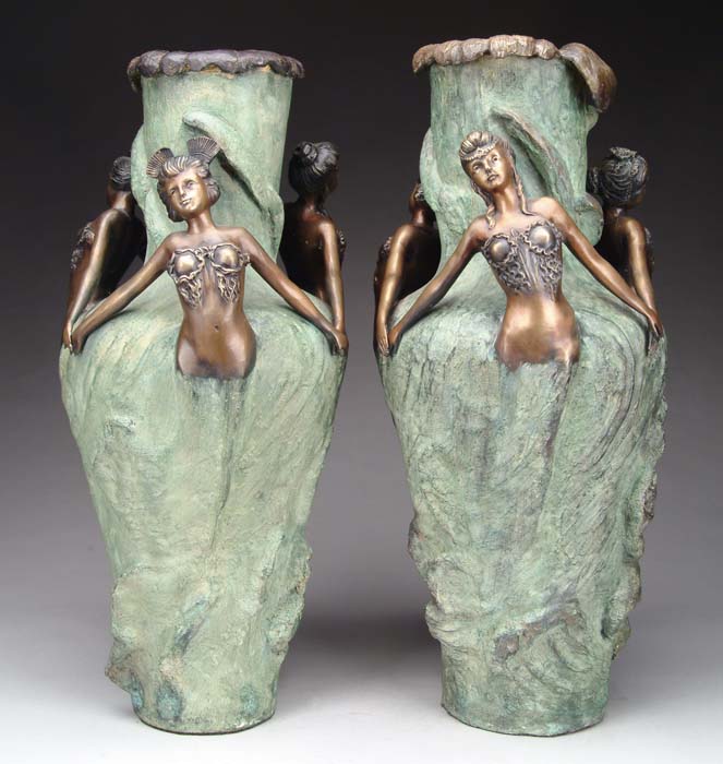 Appraisal: PAIR OF UNSIGNED VASES DECORATED WITH THREE MAIDENS Tall naturalistic