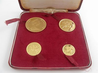 Appraisal: A cased gold coin set comprising a five pound coin