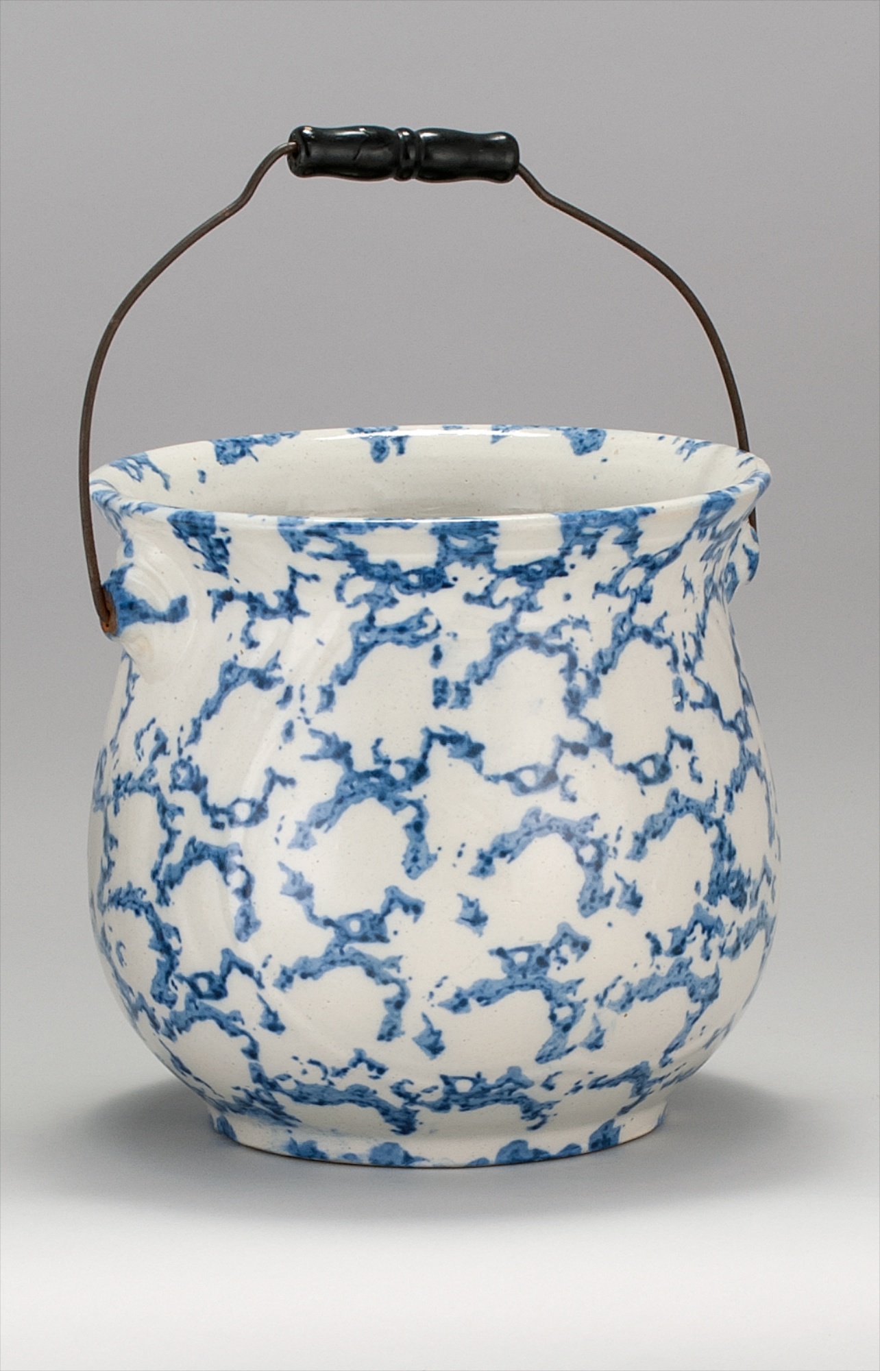 Appraisal: SPONGEWARE POTTERY HANDLED WASTE BUCKET th CenturyIn blue and white