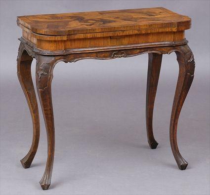 Appraisal: GERMAN ROCOCO CARVED AND INLAID WALNUT GAMES TABLE The shaped