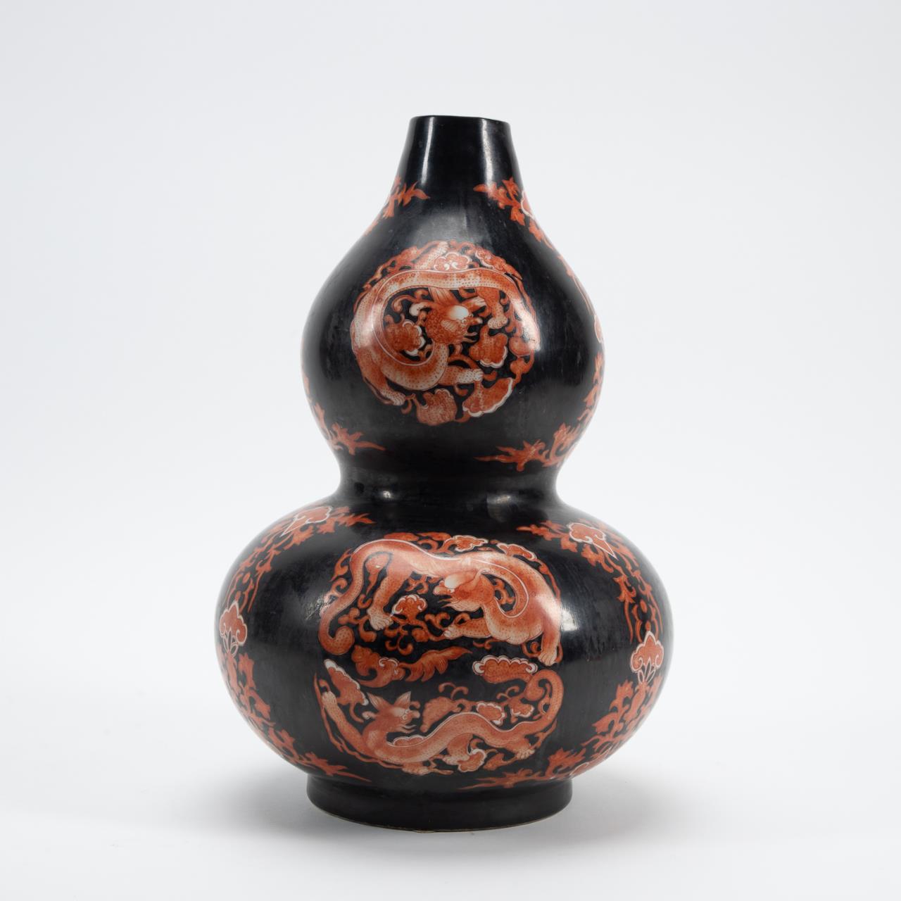 Appraisal: IRON-RED BLACK GROUND DOUBLE GOURD DRAGON VASE Chinese Famille Noir