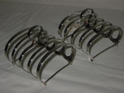 Appraisal: A PAIR OF TOAST RACKS of oblong form with five