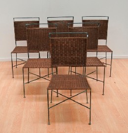 Appraisal: A set of six wrought iron and caned dining chairs