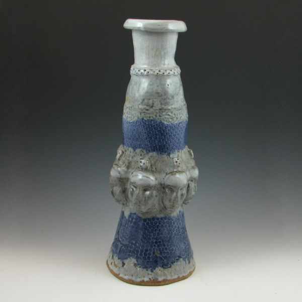 Appraisal: Contemporary vase with faces in gray and blue Unmarked Mint