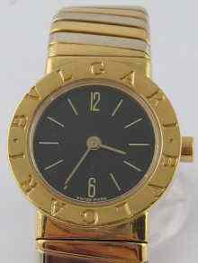 Appraisal: A two colour carat gold bangle watch by Bulgari with