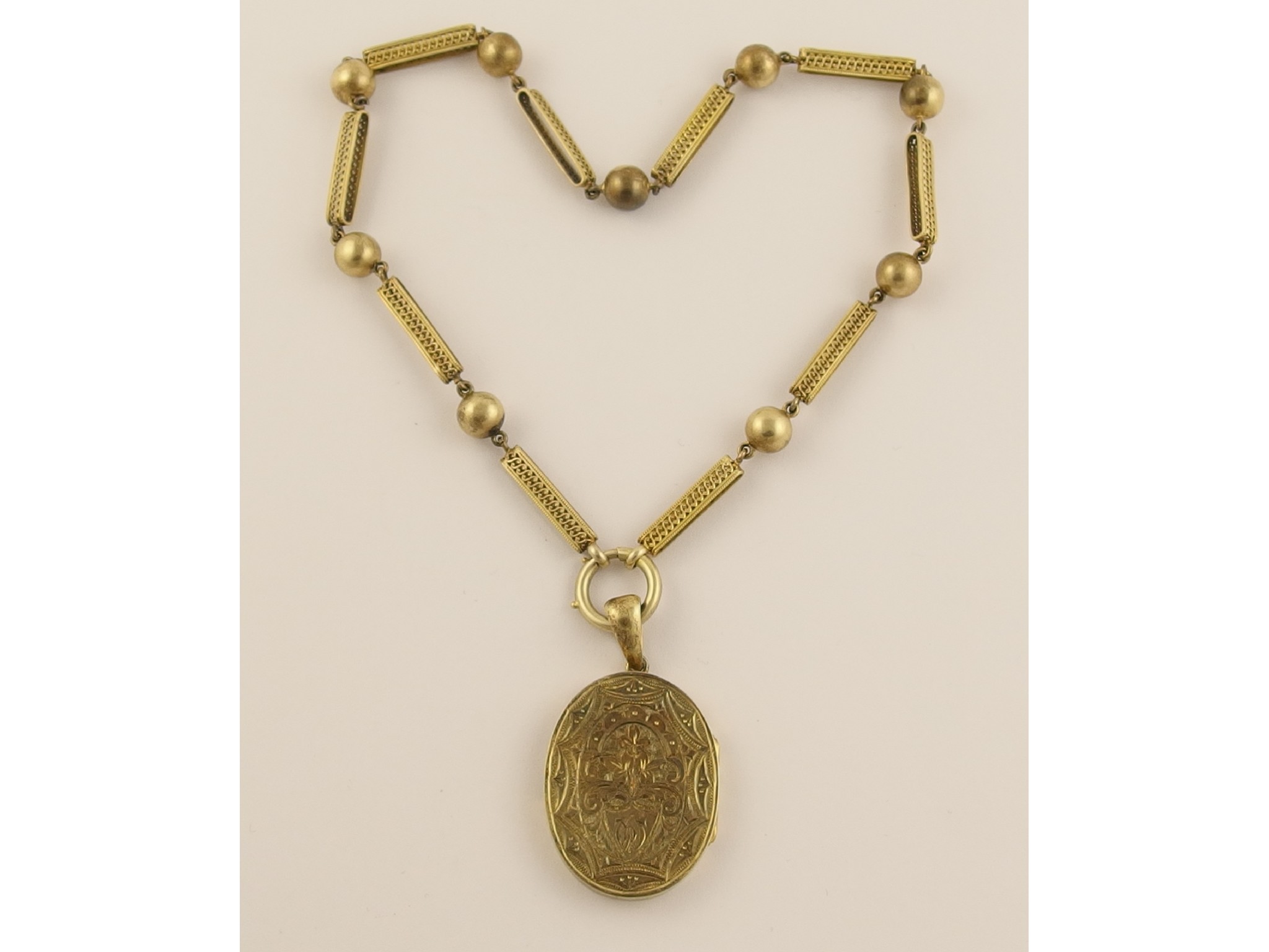 Appraisal: A Victorian locket and fancy neck chainmade from gilded white