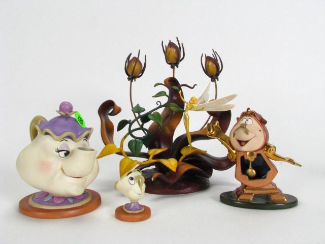 Appraisal: four items- Walt Disney Classics Collection Porcelain Figures from Beauty