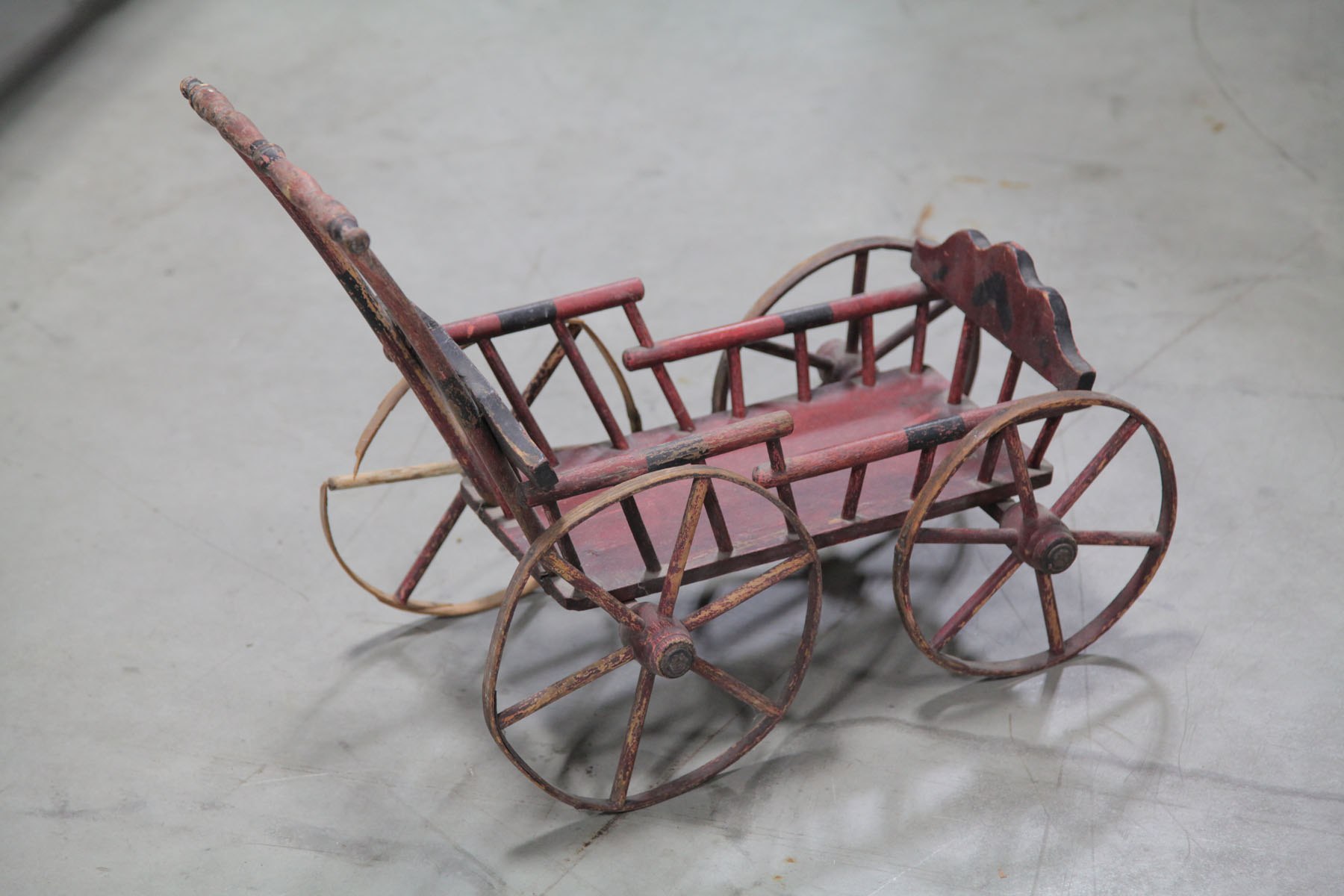 Appraisal: CHILD'S DOLL STROLLER American early th century Red and black