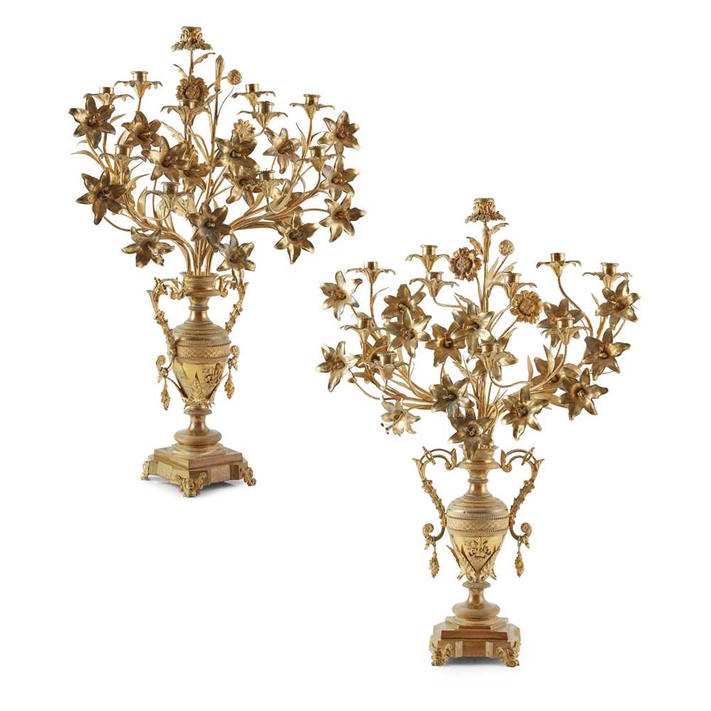 Appraisal: PAIR OF FRENCH LARGE GILT METAL CANDELABRA TH CENTURY modelled