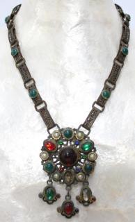 Appraisal: Tribal Faux The medallion with variously colored cabochons and three