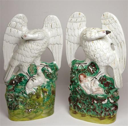 Appraisal: A pair of th century Staffordshire figures of eagles each