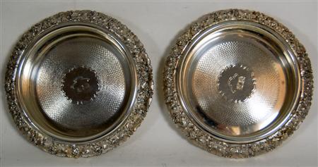 Appraisal: A pair of silver plated bottle coasters of circular outline