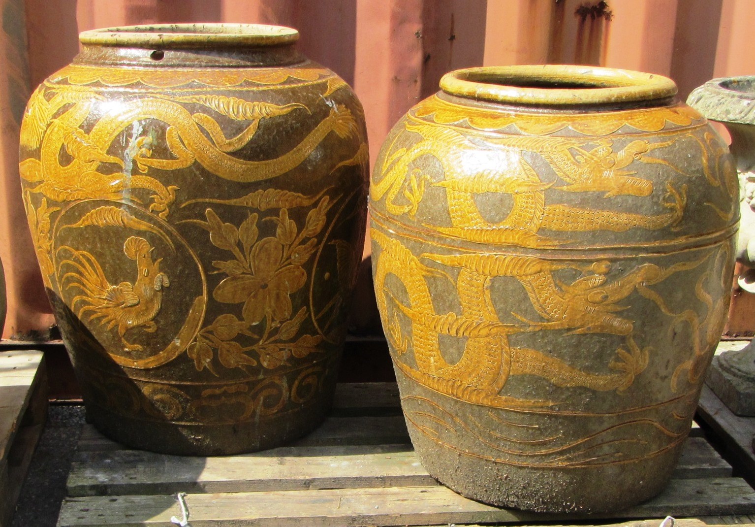 Appraisal: A near pair of slip decorated earthenware jardineres each approx