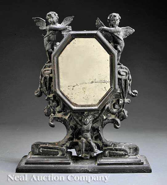 Appraisal: An Italian Rococo-Style Carved Gessoed and Ebonized Dressing Mirror th