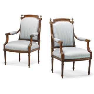 Appraisal: PAIR OF LOUIS XVI STYLE WALNUT ARMCHAIRS Padded back and