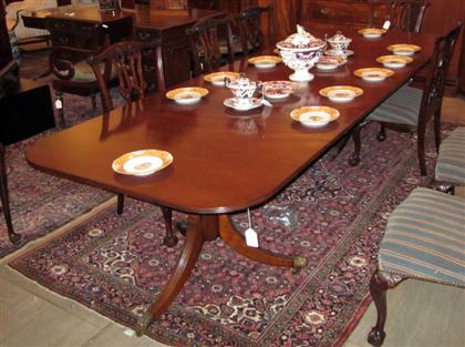 Appraisal: English mahogany two pedestal dining tableThe D-ends with a reeded