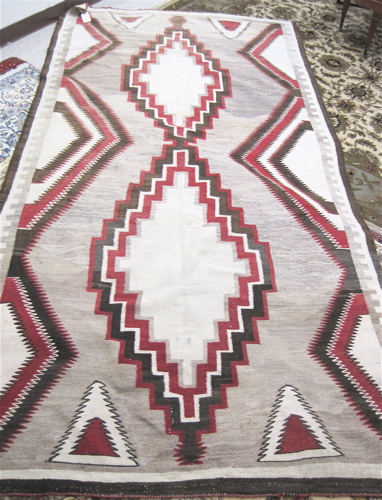 Appraisal: NAVAJO RUG hand woven in a serrated diamond and half-diamond