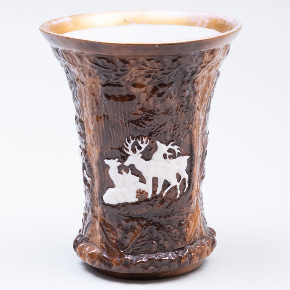 Appraisal: English Porcelain Cup Molded with Stags and Forest Relief x