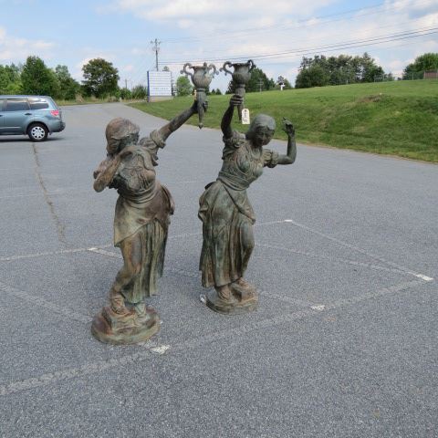 Appraisal: Pair of Bronze Figural Outdoor Lamps life size women tall