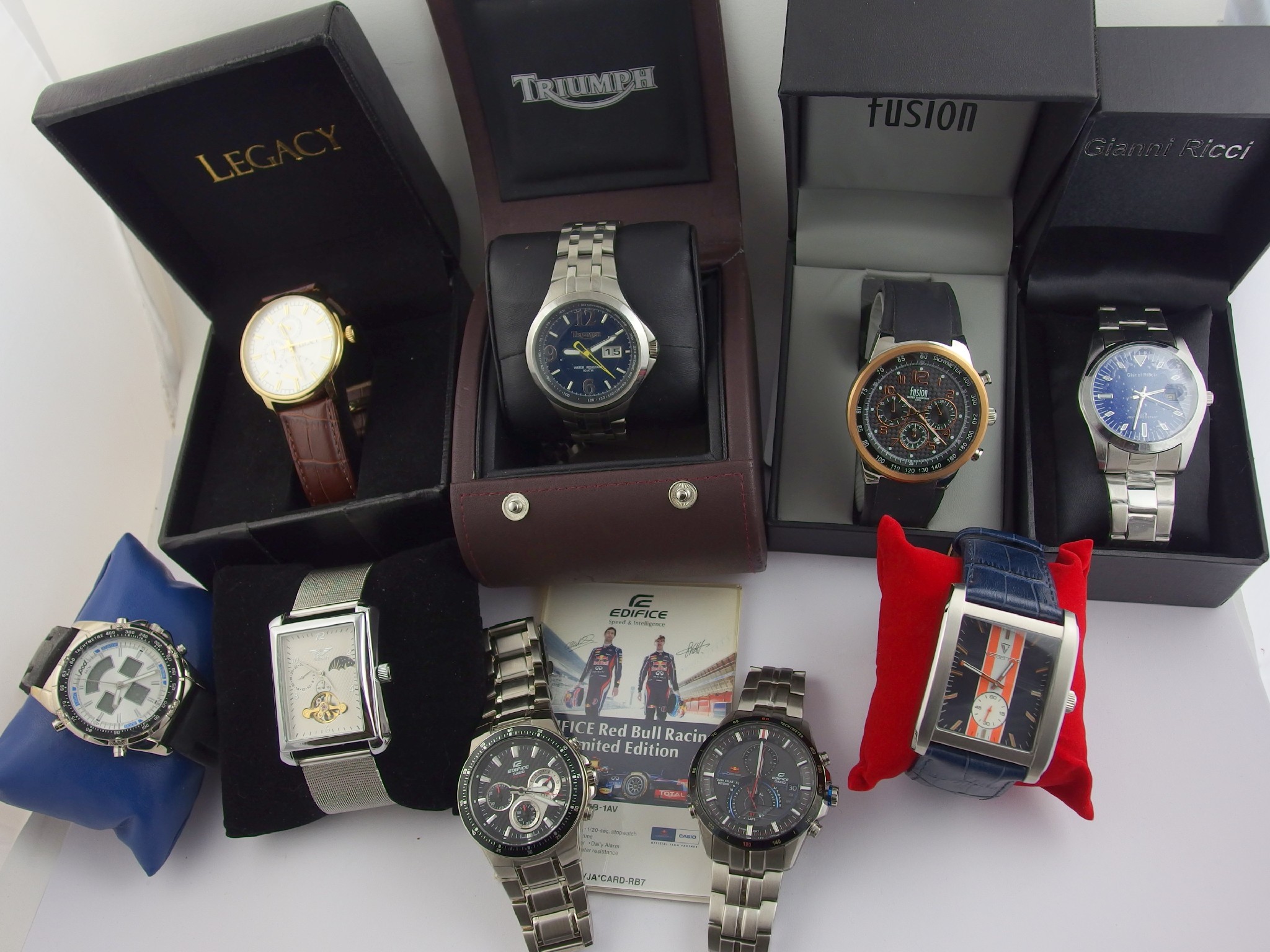 Appraisal: A collection of nine gents fashion watches in original boxes