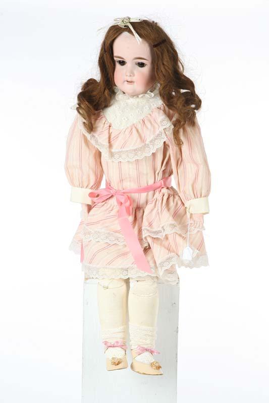 Appraisal: GERMAN DOLL Bisque head and hands sleep eyes and open