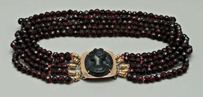 Appraisal: Mourning necklace choker with central carved black cameo clasp possibly