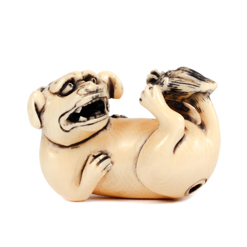 Appraisal: Japanese carved ivory netsuke lion figure marked on bottom L