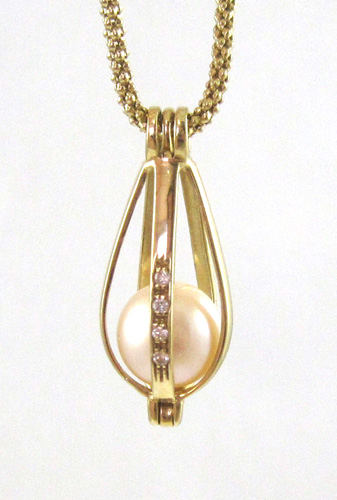 Appraisal: PEARL AND FOURTEEN KARAT GOLD CAGE PENDANT NECKLACE suspended on