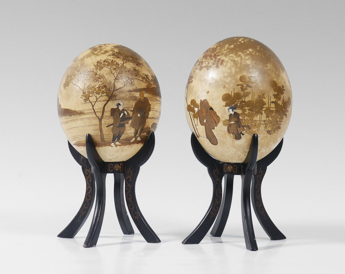 Appraisal: PAIR OF JAPANESE LACQUER DECORATED OSTRICH EGGS Applied decoration with