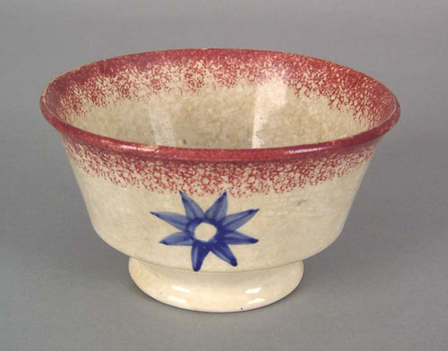 Appraisal: Red spatter waste bowl th c with blue star decoration