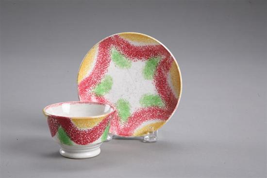 Appraisal: RAINBOW SPATTERWARE MINIATURE HANDLESS CUP AND SAUCER English st half-