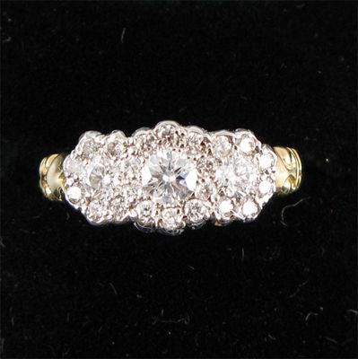 Appraisal: A diamond triple cluster ring Set in gold Size M